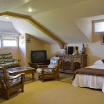 dormitorio el mirador de antonio casas rurales para grupos en Segovia